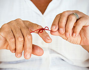 ribbon tied on finger