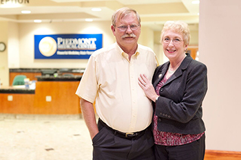 heart attack survivor Steve Crumps and his wife in piedmont medical center lobby